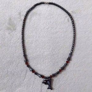 Black metallic dolphin necklace with pink gems